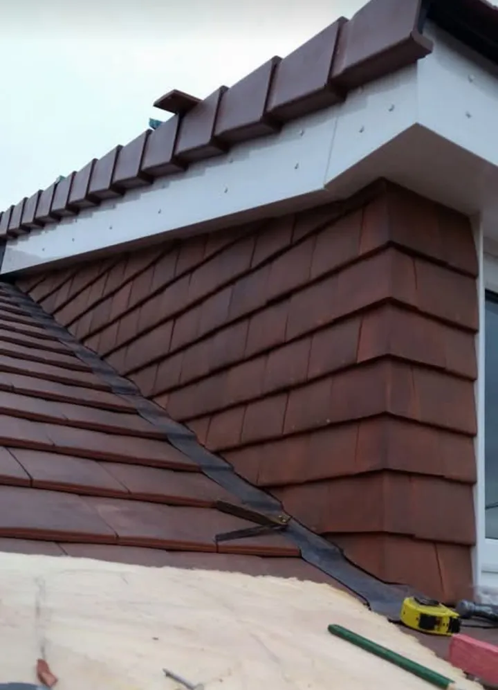 Vertical hanging clay tile cladding on dormer cheek
